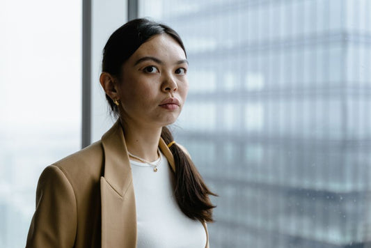 Real-person cover — woman wearing the Own the Room Ear Climbers in a workwear or office setting
