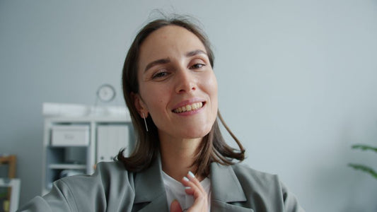 Woman wearing gold earrings for everyday work wear in Canada