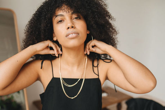 Woman wearing everyday gold hoop earrings and necklace lifestyle