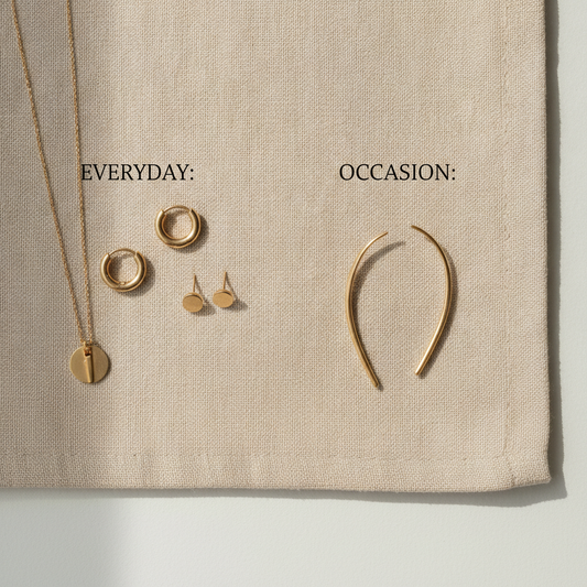 Two jewelry groupings on neutral linen: everyday hoops studs and necklace on the left, occasion ear climbers on the right