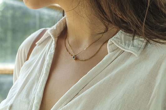 Gold vermeil hoop earrings worn by a woman in warm natural light